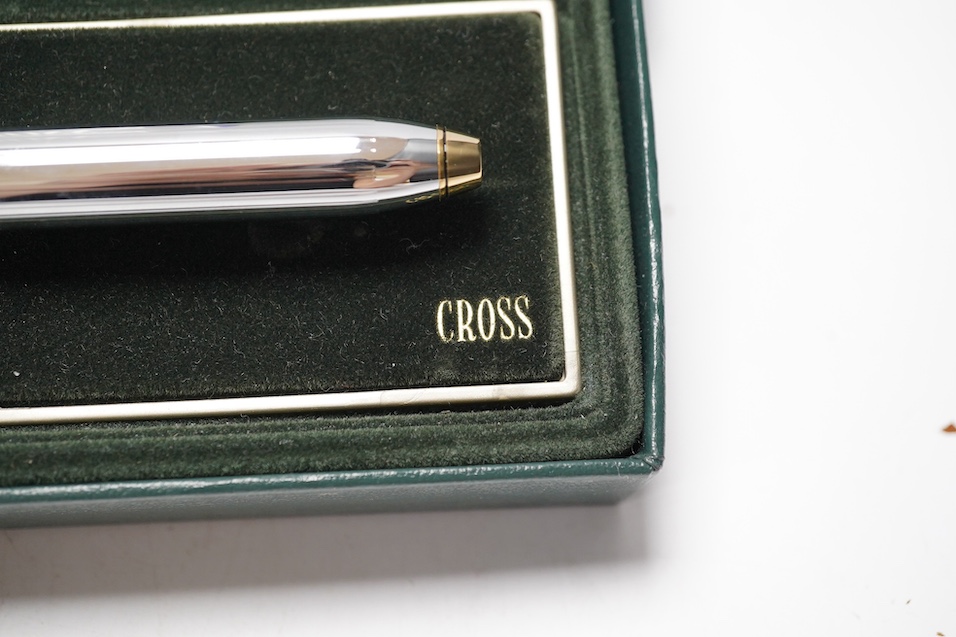 Two boxed pens; a Versace and a Cross, both with outer cardboard boxes. Condition - Versace pen good, display box good, outer box damaged. Cross pen good, ink bottle good, case damaged